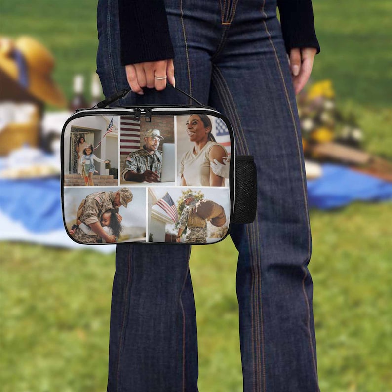 May include: A black lunch bag with a collage of photos printed on the front. The photos include a family, a soldier, and an American flag.