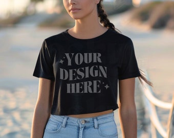 May include: A black cropped t-shirt with the text "YOUR DESIGN HERE" printed in gray on the front.