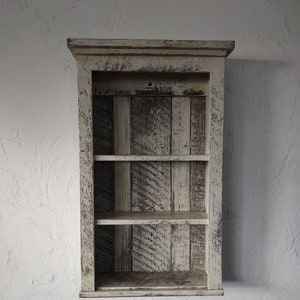 Country farmhouse wall shelf made to look like a rugged antique.