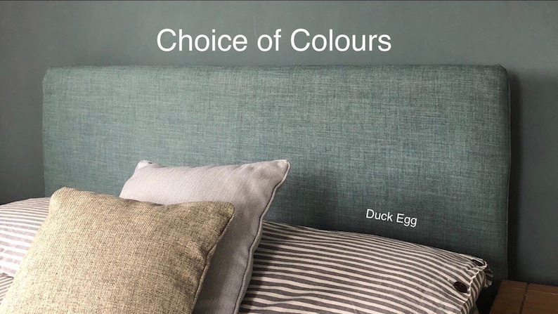 May include: A teal headboard with the text "Duck Egg" on it. The headboard is made of a textured fabric.
