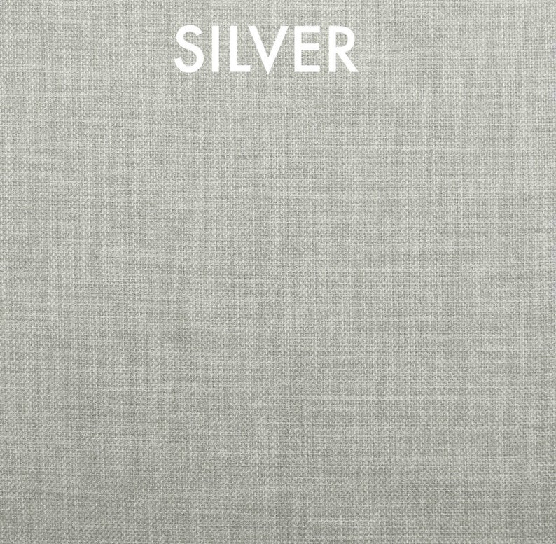 May include: A close-up of a silver fabric with a woven texture.