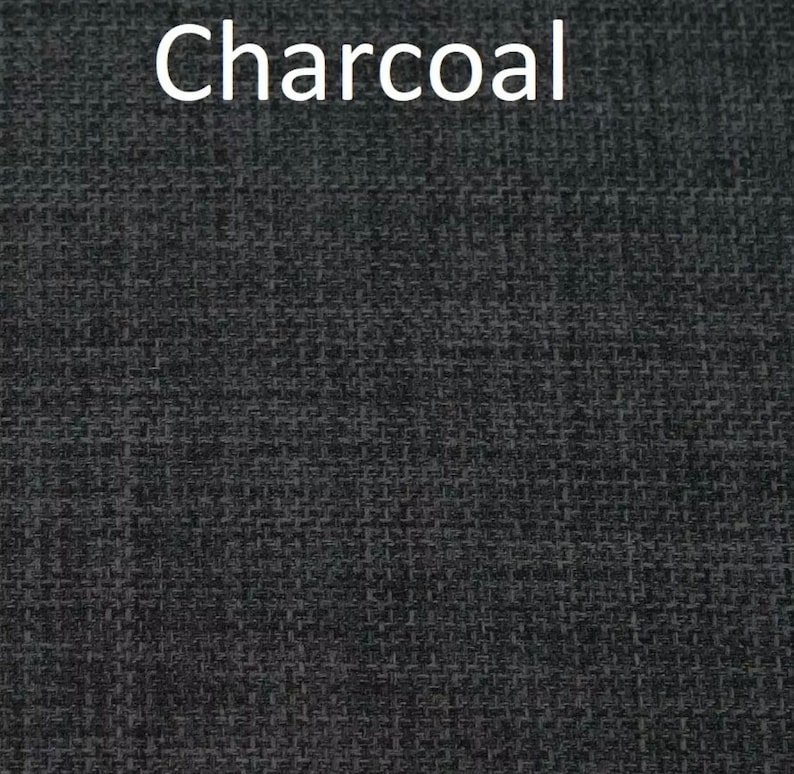 May include: Close-up of a charcoal gray fabric with a textured weave.