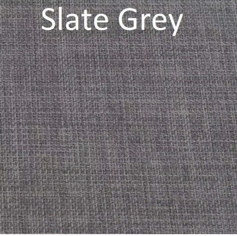May include: Close-up of a slate grey fabric with a woven texture.