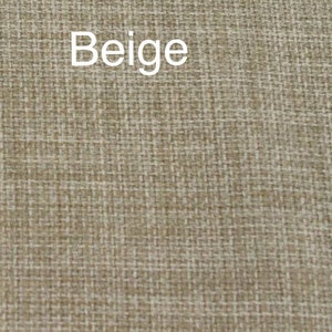 May include: Beige fabric with a woven texture.