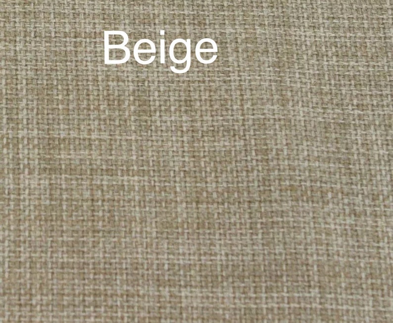 May include: Beige fabric with a woven texture.