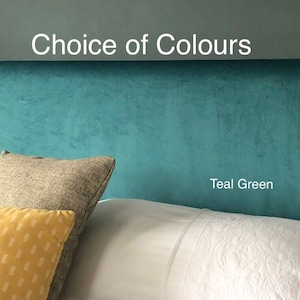 May include: Teal green headboard with a choice of colors text above it. The headboard is made of a soft, velvety fabric.