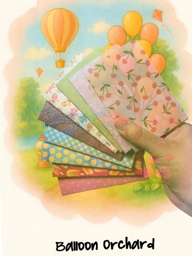 May include: A fan of rectangular paper sheets featuring diverse patterns including cherries, butterflies, gingham, polka dots, and glittery textures, displayed against a background illustration of hot air balloons and the text Balloon Orchard.
