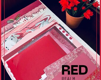 May include: A collection of red and pink paper sheets and patterned scrapbook paper. The text "RED REALM" is visible. A small terracotta pot with red flowers sits in the background. The paper has various textures and patterns.