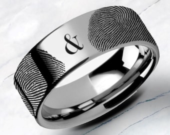 May include: A silver wedding band with a fingerprint design and the ampersand symbol engraved on the top.