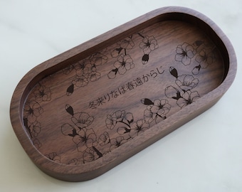 May include: A wooden oval tray with a floral design and the Japanese text "冬来りなば春遠からじ" (Winter has come, so spring is not far behind).