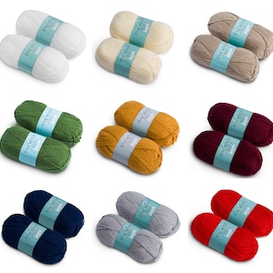 May include: Two balls of Premier Value yarn in nine different colours: white, cream, beige, green, mustard yellow, burgundy, navy blue, grey, and red.