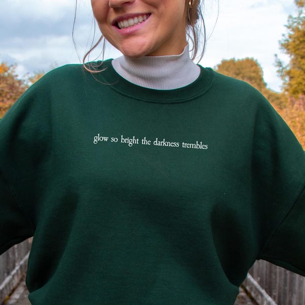 Spark of the Everflame Sweatshirt (Officially Licensed) Kindred's Curse Saga Merch, Everflame quote, Penn Cole Merch, House Corbois sweater