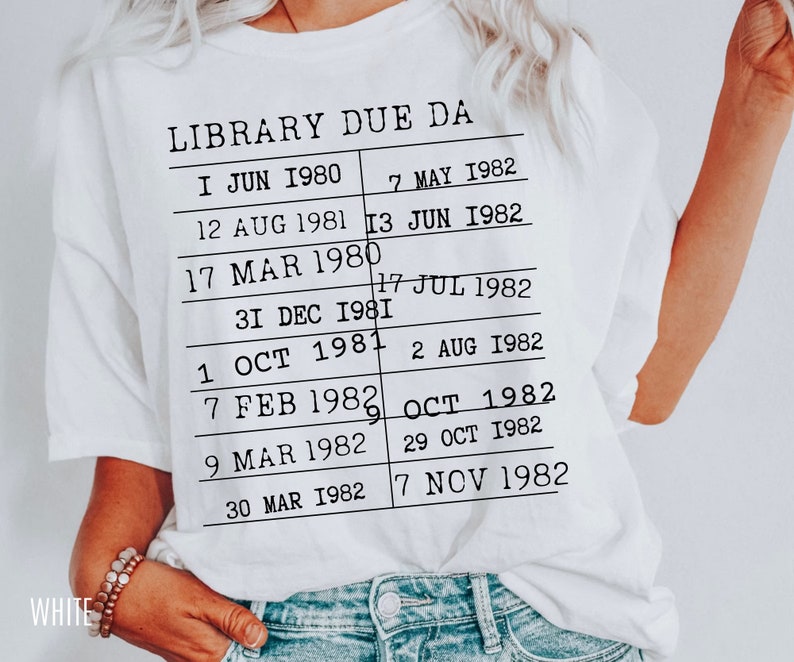 May include: White t-shirt with black text that reads "LIBRARY DUE DA" and a list of dates from 1980 to 1982.