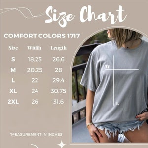 May include: A size chart for Comfort Colors 1717 t-shirts. The chart shows measurements in inches for sizes S, M, L, XL, and 2XL. The width measurements range from 18.25 to 26 inches, and the length measurements range from 26.6 to 31.6 inches.