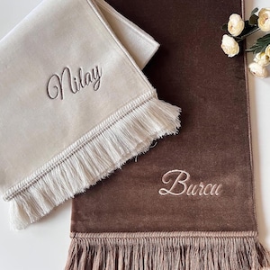 Prayer rug embroidered with name, cream brown tones