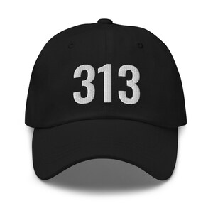 May include: Black baseball cap with white embroidered text "313" on the front.