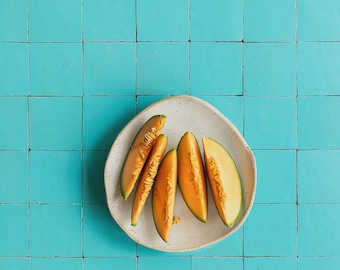 Turquoise blue photography surface with printed tile texture. Designed and printed in the Netherlands.