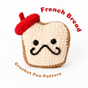 Puede incluir: Una rebanada de pan de ganchillo de felpa con corteza tostada y centro color crema, que lleva una pequeña boina roja. Presenta ojos de plástico negro y un bigote negro bordado. El texto "French Bread" y "Crochet Pun Pattern" aparece cerca.