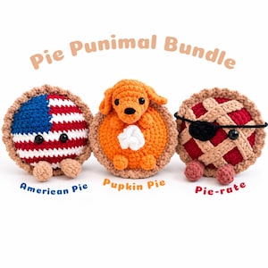May include: A set of three crocheted plush toys titled Pie Punimal Bundle. The first is an American Pie with a flag pattern, the second is a Pupkin Pie with a dog, and the third is a Pie-rate with an eye patch. Each has small round feet.