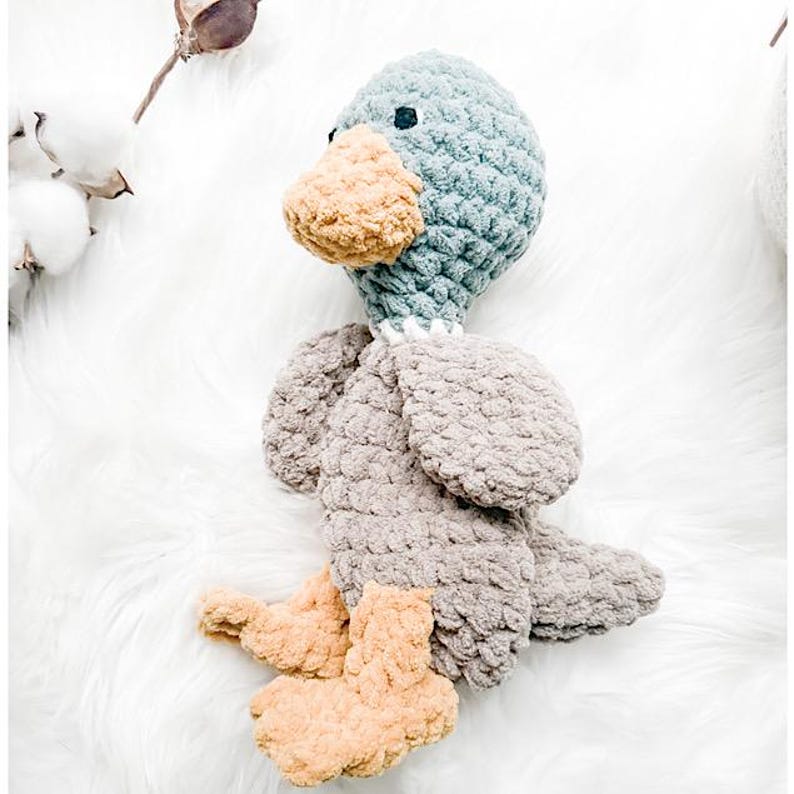 Blue and Taupe mallard Duck lovey with yellow feet and beak. velvet soft yarn make it soft and cuddly.
