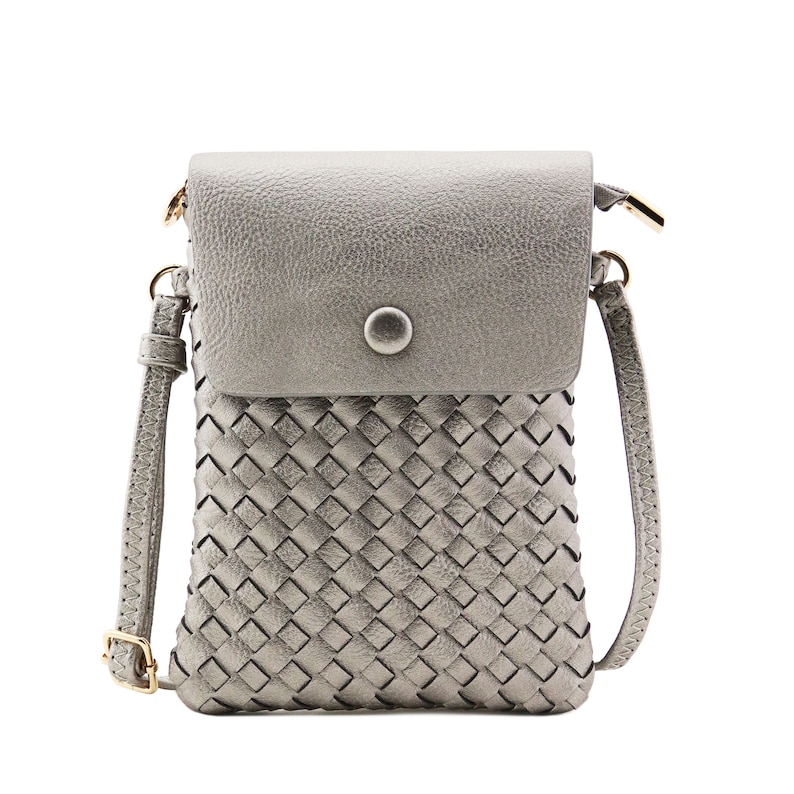 May include: A silver woven crossbody bag with a flap closure and a single button. The bag has a long adjustable strap.