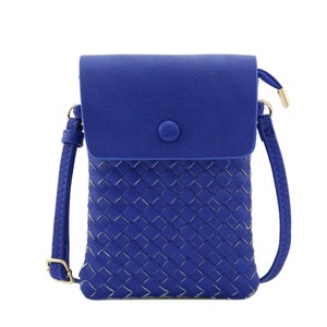 May include: A small blue crossbody bag with a woven front panel and a flap closure. The bag has a gold-tone button and a detachable strap.
