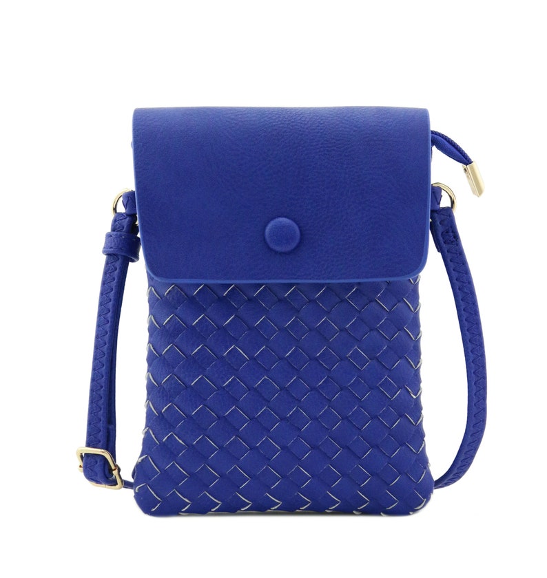May include: A small blue crossbody bag with a woven front panel and a flap closure. The bag has a gold-tone button and a detachable strap.