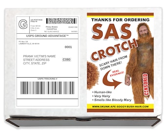 May include: A white cardboard box with a shipping label and a humorous graphic. The graphic features the text "SAS CROTCH" with a hairy creature illustration and the words "Scary Hair From Down There!"