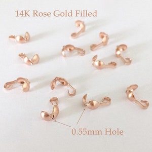 May include: 14K Rose Gold Filled Clasps with a 0.55mm hole. These clasps are perfect for jewelry making and are available in a variety of colors.