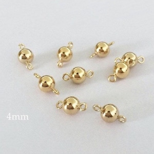 May include: Eight gold-toned metal bead caps with two loops on each side. The beads are 4mm in diameter. 4mm
