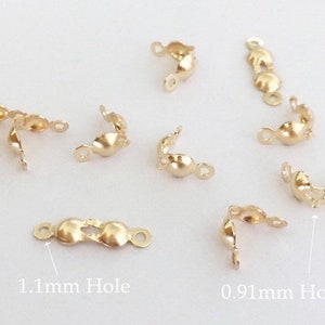 May include: Gold-toned metal clasps with two different hole sizes: 0.91mm and 1.1mm. These clasps are ideal for jewellery making and crafting.