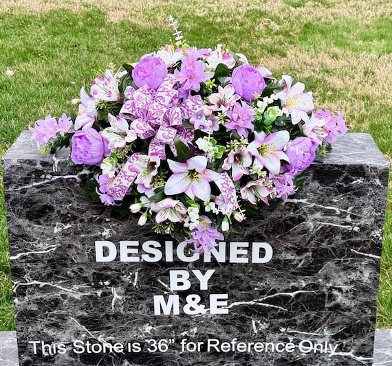 Violet White Flowers Cemetery Saddle Arrangement with Bow