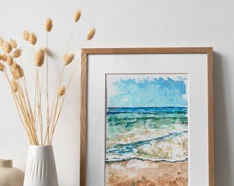 May include: A framed painting of a seascape with blue and green water, white waves, and a sandy beach.