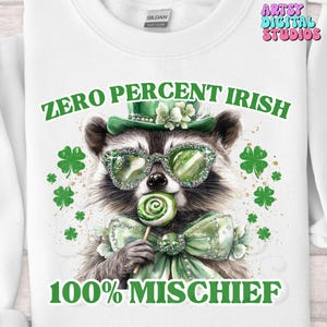 May include: A white sweatshirt with a green raccoon wearing a green hat, sunglasses, and a green bow tie. The raccoon is holding a green lollipop. The text "ZERO PERCENT IRISH 100% MISCHIEF" is printed on the sweatshirt.