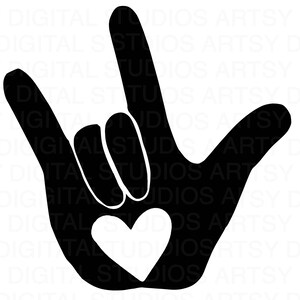 Op de afbeelding: Zwarte silhouet van een hand die het Amerikaanse gebarentaal symbool voor "Ik hou van je" vormt. De hand maakt het "Ik hou van je" teken met een wit hart in het midden van de palm.