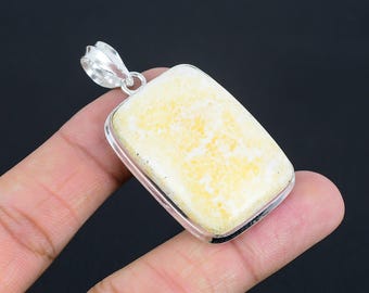 May include: A silver pendant featuring a rectangular yellow and white gemstone. The pendant has a smooth, polished finish and a simple design.