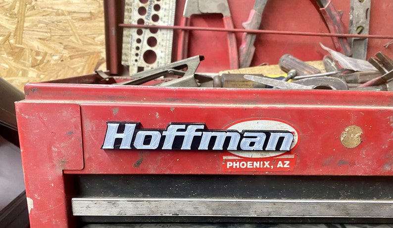 May include: A red metal toolbox with a silver Hoffman logo and the text "PHOENIX, AZ".