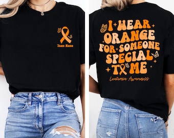 Camiseta de concientización sobre la leucemia, camiseta de concientización con lazo naranja, camiseta del equipo de apoyo contra la leucemia, su lucha es nuestra lucha, regalo del mes de concientización