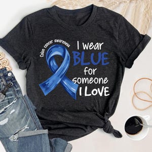Colon Cancer Awareness Shirt, I Wear Blue For Someone I Love, Blue Ribbon Tee, Cancer Survivor Gift, Colon Cancer Warrior Support Shirt