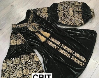 May include: A dark green velvet blouse with gold embroidery featuring floral patterns. The blouse has long sleeves with gathered cuffs and a round neckline. The text "СВІТ ВИШИВАНОК" is embroidered on the front of the blouse.