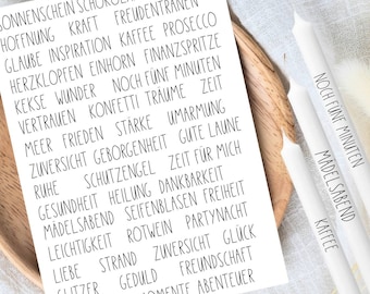 May include: A white card with black text featuring a list of words like "hope," "joy," and "adventure." Three white candles with black text that reads "five more minutes," "girls' night," and "coffee" are in the image.