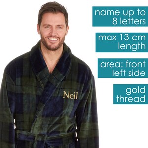 May include: A green and blue plaid robe with a gold embroidered name "Neil" on the left side. The robe has a shawl collar and a tie belt. The image includes text indicating that the name can be up to 8 letters long, with a maximum length of 13 cm, and is embroidered on the front left side with gold thread.