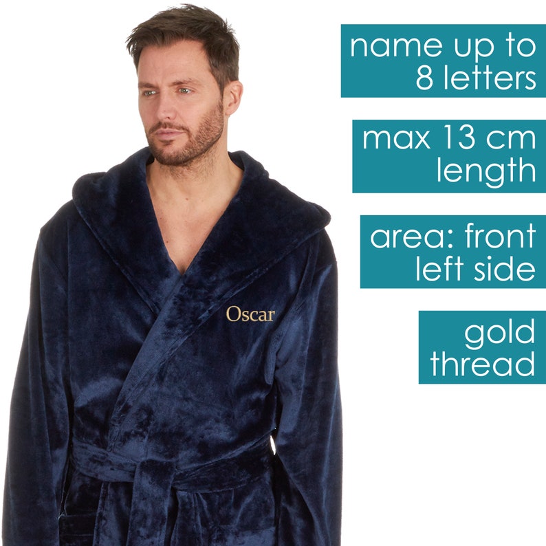 May include: A navy blue hooded robe with a gold thread embroidered name "Oscar" on the front left side. The robe has a belt and a hood. The text on the image says "name up to 8 letters", "max 13 cm length", "area: front left side", and "gold thread".