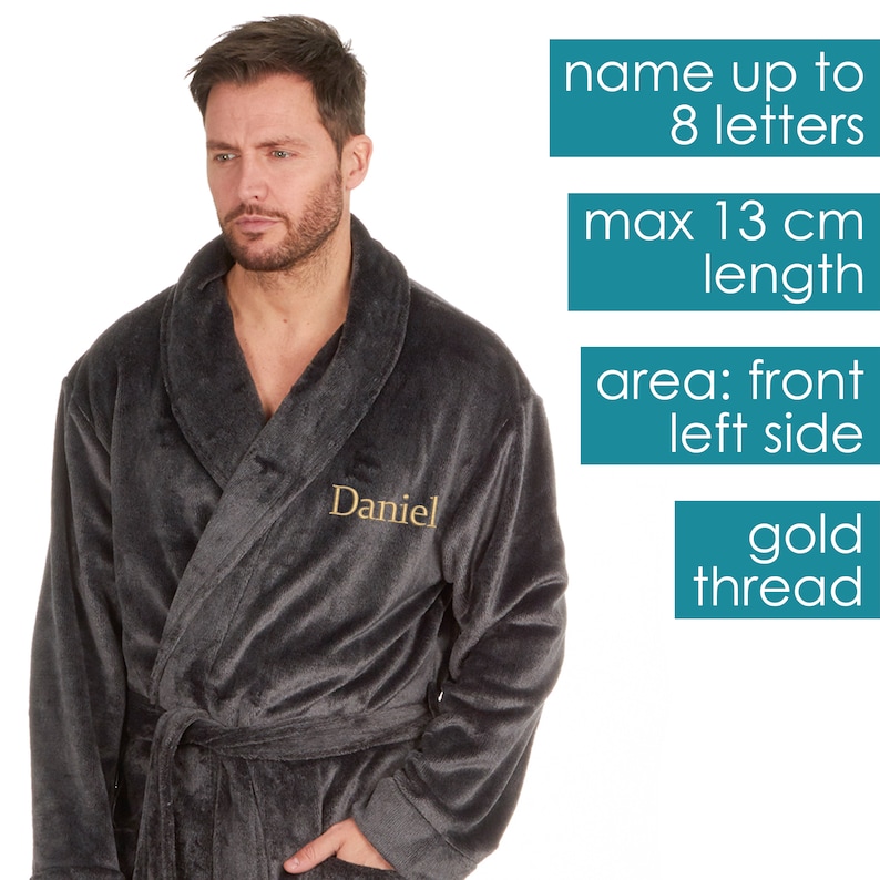 May include: A dark gray robe with a gold embroidered name "Daniel" on the left side. The robe has a shawl collar and a tie belt. The text on the image reads: "name up to 8 letters, max 13 cm length, area: front left side, gold thread".
