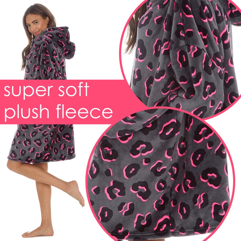 May include: A grey hooded blanket with a pink leopard print. The blanket is made of soft plush fleece.