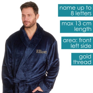 May include: A navy blue robe with a gold thread embroidered name "Elliott" on the left side. The robe has a shawl collar and a tie belt. The image includes text indicating the maximum length of the name that can be embroidered is 8 letters and 13 cm.