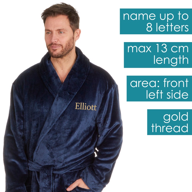 May include: A navy blue robe with a gold thread embroidered name "Elliott" on the left side. The robe has a shawl collar and a tie belt. The image includes text indicating the maximum length of the name that can be embroidered is 8 letters and 13 cm.