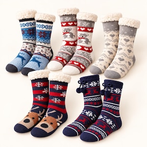 May include: Four pairs of mid-calf socks featuring various patterns including reindeer, teddy bears, hearts, and snowflakes. The socks have white sherpa-style cuffs and some include decorative pom-poms. Colours include blue, red, grey, and cream.