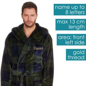 May include: A green and blue plaid hooded robe with a gold thread embroidered name "Daniel" on the front left side. The robe has a belt and a hood. The name can be personalized with up to 8 letters and the maximum length of the name is 13 cm.