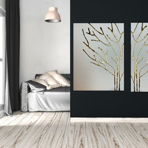 May include: Two gold leaf tree branch wall art pieces on a white background. The art is framed and hung on a black wall.